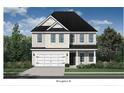 Two-story beige home with white garage door and landscaping at 221 Old Grove Ave, Moncks Corner, SC 29461