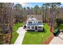 Aerial view of two-story white house at 2042 Bullyard Sound Way, Awendaw, SC 29429