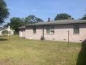 View of the back of the house and yard at 2141 Gaillard Ln, North Charleston, SC 29405