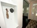 White built-in coat closet with seating and hooks at 420 Eagleview Dr, Moncks Corner, SC 29461