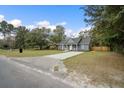 House with a wide driveway and a fenced backyard at 309 Meadow St, Walterboro, SC 29488