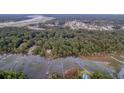 Aerial view of a waterfront community with lush greenery and marsh views at 639 Faulkner Dr, Mount Pleasant, SC 29466