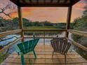 Serene waterfront view from a covered deck at sunset at 639 Faulkner Dr, Mount Pleasant, SC 29466