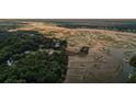 Aerial view of waterfront homes and marsh at sunset at 635 Faulkner Dr, Mount Pleasant, SC 29466