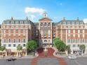 Brick building with fountain, retail spaces, and residential units at 609 King St # 334, Charleston, SC 29403