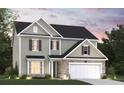 Two-story house with gray siding, brick accents, and a two-car garage at 3000 Middleton Dr, Goose Creek, SC 29445