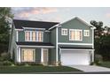 Two story home with a two-car garage and landscaping at 5000 Middleton Dr, Goose Creek, SC 29445