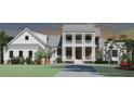 White two-story house with a metal roof, three-car garage, and landscaping at 117 Silverbell Ln, Hollywood, SC 29470