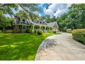 Two-story home with a three-car garage and circular driveway at 5057 Hwy 174, Hollywood, SC 29449