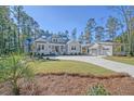 Gray house with detached garage and landscaping at 19 Bradley Pasture Way, Ravenel, SC 29470