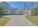 House with detached garage and long driveway at 19 Bradley Pasture Way, Ravenel, SC 29470
