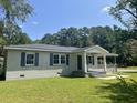 Charming one-story home with a covered porch at 902 Poplar St, Walterboro, SC 29488