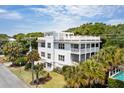 Elevated view of a white house with a pool at 7 33Rd Ave, Isle of Palms, SC 29451