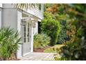 White basement entrance with double doors and landscaping at 7 33Rd Ave, Isle of Palms, SC 29451