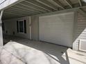 Attached garage with white door and ample parking space at 757 Backfield Rd, Walterboro, SC 29488