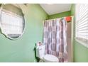 Small bathroom with green walls and shower at 1157 Symmes Dr, Charleston, SC 29407