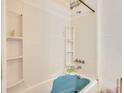 Bathroom with a blue bathtub and white tile at 1157 Symmes Dr, Charleston, SC 29407