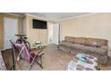 Living room with exposed plywood floors at 1157 Symmes Dr, Charleston, SC 29407