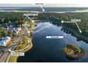 Aerial view of community lake, boardwalk, and homes at 3834 Delinger Dr, Mount Pleasant, SC 29466