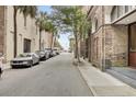 Quiet street with parked cars and charming historic architecture at 3 Queen St # 315, Charleston, SC 29401