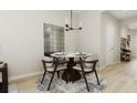 Elegant dining room with a round table and modern chairs at 212 Greenling St, Goose Creek, SC 29445