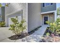 House exterior showcasing the front entrance and garage at 466 Cedarview Rd, Summerville, SC 29486