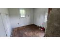 Small bedroom needing renovation, with damaged flooring at 189 Joe Felder Rd, Ridgeville, SC 29472
