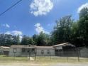 House exterior with carport and chain link fence at 1005 Longpoint Rd, Cross, SC 29436