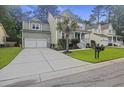 Two-story house with a two-car garage and a large front yard at 3336 Toomer Kiln Cir, Mount Pleasant, SC 29466