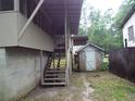 Wooden steps leading up to a screened porch at 31 Hannibal Dr, Ridgeville, SC 29472