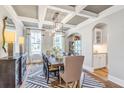 Elegant dining room with tray ceiling and coffered beams at 4045 Rowley Lane, Summerville, SC 29486