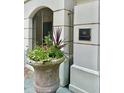 Building entrance with a stone planter and plaque at 5 Middle Atlantic Wharf # 3A, Charleston, SC 29401