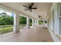 Spacious front porch with white columns and ceiling fans at 205 Valley St, Walterboro, SC 29488