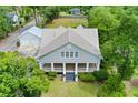 House with a metal roof, detached garage, and large backyard at 205 Valley St, Walterboro, SC 29488