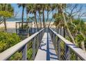 Elevated boardwalk leading to gazebo overlooking ocean at 403 Pelican Flight Dr, Dewees Island, SC 29451