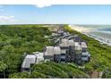 Aerial of oceanfront property, highlighting the building and surrounding area at 4426 Sea Forest Dr, Kiawah Island, SC 29455