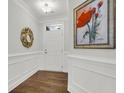 Bright entryway with hardwood floors and wainscoting at 100 Lilith Ln, Summerville, SC 29485