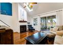 Living room with fireplace, hardwood floors, and water views at 1721 Live Oak Park, Seabrook Island, SC 29455