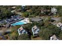 Community pool and surrounding houses from above at 2221 Oyster Catcher Ct, Seabrook Island, SC 29455