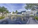 View of Hayes Park community with white houses and a shared courtyard at 532 Hayes Park Blvd # 5, Johns Island, SC 29455