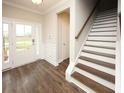 Bright and spacious entryway with hardwood floors, white doors and staircase at 508 Eagleview Dr, Moncks Corner, SC 29461