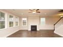 Living room with hardwood floors, fireplace and large windows at 508 Eagleview Dr, Moncks Corner, SC 29461