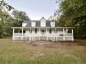Two-story home with wrap-around porch and large yard at 138 Waddell Ln, Ridgeville, SC 29472