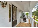 Front porch with rocking chairs and a view of the street at 1714 Cultivation Ln # 537, Mount Pleasant, SC 29466