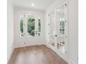 Light and airy entryway with hardwood floors and access to front porch at 1714 Cultivation Ln # 537, Mount Pleasant, SC 29466