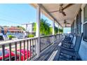 Relaxing front porch with rocking chairs and street view at 118 E Ashley And 110 E Cooper Ave Ave, Folly Beach, SC 29439