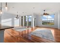 Spacious living room with hardwood floors and large windows offering scenic views at 252 Cooper River Dr, Mount Pleasant, SC 29464