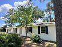 Charming brick ranch home with a newly landscaped yard at 401 Constance St, Walterboro, SC 29488