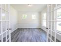 Bright office with hardwood floors, wainscoting, and French doors at 119 Ashley Cove Way, Summerville, SC 29483