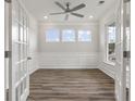 Bright office with hardwood floors, white walls, and three windows at 115 Ashley Cove Way, Summerville, SC 29483
